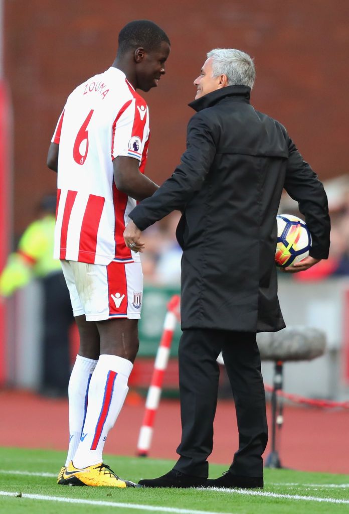 STOKE ON TRENT, ENGLAND - SEPTEMBER 09:  Kurt Zouma of Stoke City and Jose Mourinho, Manager of Manchester United speak during the Premier League match between Stoke City and Manchester United at Bet365 Stadium on September 9, 2017 in Stoke on Trent, England.  (Photo by Richard Heathcote/Getty Images)