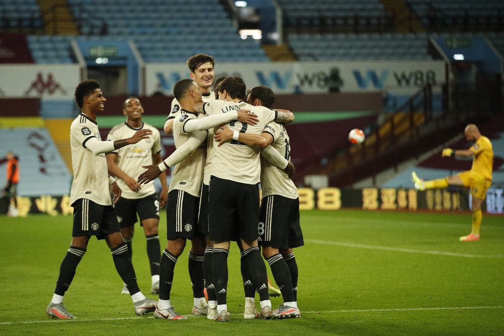 BIRMINGHAM, ENGLAND - JULY 09: Paul Pogba of Manchester United celebrates with his team mates after scoring his team's third goal during the Premier League match between Aston Villa and Manchester United at Villa Park on July 09, 2020 in Birmingham, England. Football Stadiums around Europe remain empty due to the Coronavirus Pandemic as Government social distancing laws prohibit fans inside venues resulting in all fixtures being played behind closed doors. (Photo by Andrew Boyers/Pool via Getty Images)