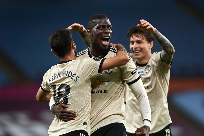 BIRMINGHAM, ENGLAND - JULY 09: Paul Pogba of Manchester United celebrates with Bruno Fernandes and Victor Lindelof after scoring his teams third goal during the Premier League match between Aston Villa and Manchester United at Villa Park on July 09, 2020 in Birmingham, England. Football Stadiums around Europe remain empty due to the Coronavirus Pandemic as Government social distancing laws prohibit fans inside venues resulting in all fixtures being played behind closed doors. (Photo by Shaun Botterill/Getty Images)
