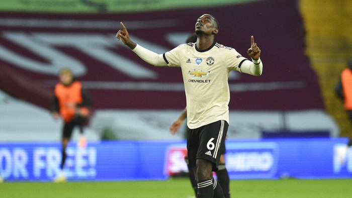 Manchester Uniteds Paul Pogba celebrates after scoring his teams third goal during the English Premier League soccer match between Aston Villa and Manchester United at Villa Park in Birmingham, England, Thursday, July 9, 2020. (AP Photo/Oli Scarff,Pool)