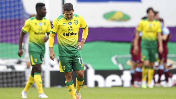 CORRECTS NAME OF PLAYER Norwich City’s Emi Buendia is dejected after West Hams third goal during the English Premier League soccer match between Norwich City and West Ham at the Carrow Road stadium in Norwich, England, Saturday, July 11, 2020. (Alex Pantling/Pool via AP)