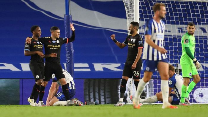Manchester City BRIGHTON, ENGLAND - JULY 11: Raheem Sterling of Manchester City celebrates after scoring his teams fifth goal, his hattrick, with team mates Riyad Mahrez and Phil Foden during the Premier League match between Brighton & Hove Albion and Manchester City at American Express Community Stadium on July 11, 2020 in Brighton, England. Football Stadiums around Europe remain empty due to the Coronavirus Pandemic as Government social distancing laws prohibit fans inside venues resulting in all fixtures being played behind closed doors. (Photo by Catherine Ivill/Getty Images)