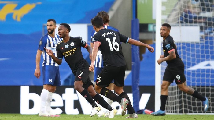 BRIGHTON, ENGLAND - JULY 11: Raheem Sterling of Manchester City celebrates after scoring his teams first goal during the Premier League match between Brighton & Hove Albion and Manchester City at American Express Community Stadium on July 11, 2020 in Brighton, England. Football Stadiums around Europe remain empty due to the Coronavirus Pandemic as Government social distancing laws prohibit fans inside venues resulting in all fixtures being played behind closed doors. (Photo by Julian Finney/Getty Images)