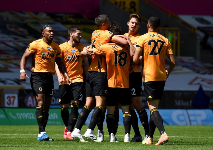 WOLVERHAMPTON, ENGLAND - JULY 12: Diogo Jota of Wolverhampton Wanderers celebrates after he scores his teams third goal during the Premier League match between Wolverhampton Wanderers and Everton FC at Molineux on July 12, 2020 in Wolverhampton, England. Football Stadiums around Europe remain empty due to the Coronavirus Pandemic as Government social distancing laws prohibit fans inside venues resulting in all fixtures being played behind closed doors. (Photo by Ben Stansall/Pool via Getty Images)