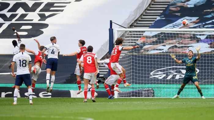 LONDON, ENGLAND - JULY 12: Toby Alderweireld of Tottenham Hotspur  scores his teams second goal  during the Premier League match between Tottenham Hotspur and Arsenal FC at Tottenham Hotspur Stadium on July 12, 2020 in London, England. Football Stadiums around Europe remain empty due to the Coronavirus Pandemic as Government social distancing laws prohibit fans inside venues resulting in all fixtures being played behind closed doors. (Photo by Michael Regan/Getty Images)