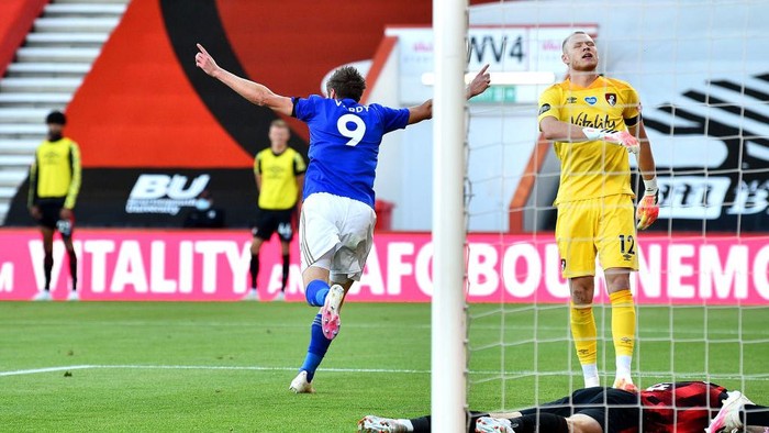 BOURNEMOUTH, ENGLAND - JULY 12: Jamie Vardy of Leicester City celebrates after he  scores his teams first goal  during the Premier League match between AFC Bournemouth and Leicester City at Vitality Stadium on July 12, 2020 in Bournemouth, England. Football Stadiums around Europe remain empty due to the Coronavirus Pandemic as Government social distancing laws prohibit fans inside venues resulting in all fixtures being played behind closed doors. (Photo by Glyn Kirk/Pool via Getty Images)