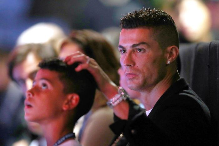 Cristiano Ronaldo Jr LONDON, ENGLAND - NOVEMBER 12: Cristiano Ronaldo and son Cristiano Ronaldo Jr. watch on during the singles round robin match between Novak Djokovic of Serbia and John Isner of The United States during Day Two of the Nitto ATP Finals at The O2 Arena on November 12, 2018 in London, England. (Photo by Naomi Baker/Getty Images)