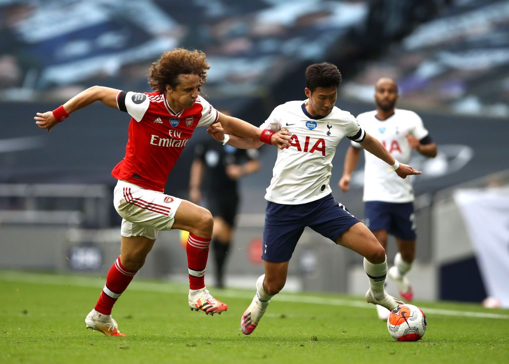 LONDON, ENGLAND - JULY 12: David Luiz of Arsenal  battles for possession with  Heung-Min Son of Tottenham Hotspur  during the Premier League match between Tottenham Hotspur and Arsenal FC at Tottenham Hotspur Stadium on July 12, 2020 in London, England. Football Stadiums around Europe remain empty due to the Coronavirus Pandemic as Government social distancing laws prohibit fans inside venues resulting in all fixtures being played behind closed doors. (Photo by Tim Goode/Pool via Getty Images)