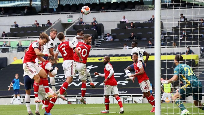 LONDON, ENGLAND - JULY 12: Toby Alderweireld of Tottenham Hotspur scores his sides second goal during the Premier League match between Tottenham Hotspur and Arsenal FC at Tottenham Hotspur Stadium on July 12, 2020 in London, England. Football Stadiums around Europe remain empty due to the Coronavirus Pandemic as Government social distancing laws prohibit fans inside venues resulting in all fixtures being played behind closed doors. (Photo by Julian Finney/Getty Images)