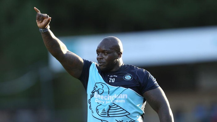 HIGH WYCOMBE, ENGLAND - AUGUST 14: Adebayo Akinfenwa of Wycombe Wanderers acknowledges the Northampton Town fans prior to the Carabao Cup First Round match between Wycombe Wanderers and Northampton Town at Adams Park on August 14, 2018 in High Wycombe, England. (Photo by Pete Norton/Getty Images)