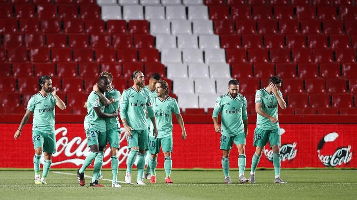 GRANADA, SPAIN - JULY 13:  Ferland Mendy of Real Madrid is congratulated after scoring the opening goal during the Liga match between Granada CF and Real Madrid CF at on July 13, 2020 in Granada, Spain. Football Stadiums around Europe remain empty due to the Coronavirus Pandemic as Government social distancing laws prohibit fans inside venues resulting in all fixtures being played behind closed doors. (Photo by Fran Santiago/Getty Images)