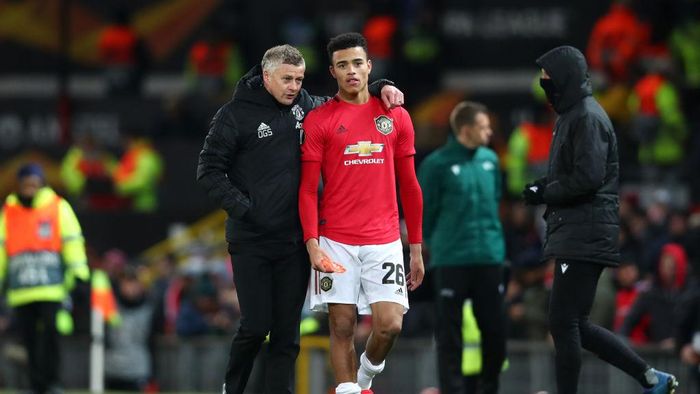 Mason Greenwood MANCHESTER, ENGLAND - FEBRUARY 27: Ole Gunnar Solskjaer, Manager of Manchester United speaks to Mason Greenwood of Manchester United following their sides victory in the UEFA Europa League round of 32 second leg match between Manchester United and Club Brugge at Old Trafford on February 27, 2020 in Manchester, United Kingdom. (Photo by Clive Brunskill/Getty Images)