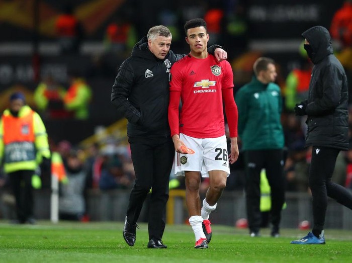 MANCHESTER, ENGLAND - FEBRUARY 27: Ole Gunnar Solskjaer, Manager of Manchester United speaks to Mason Greenwood of Manchester United following their sides victory in the UEFA Europa League round of 32 second leg match between Manchester United and Club Brugge at Old Trafford on February 27, 2020 in Manchester, United Kingdom. (Photo by Clive Brunskill/Getty Images)
