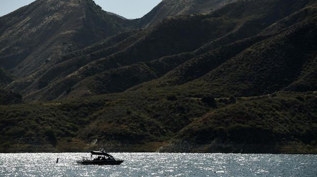 A search-and-rescue boat continues looking for missing actress Naya Rivera at Lake Piru, Friday, July 10, 2020, in Los Padres National Forest, Calif., about 55 miles (90 kilometers) northwest of Los Angeles. Authorities said that they believe the 