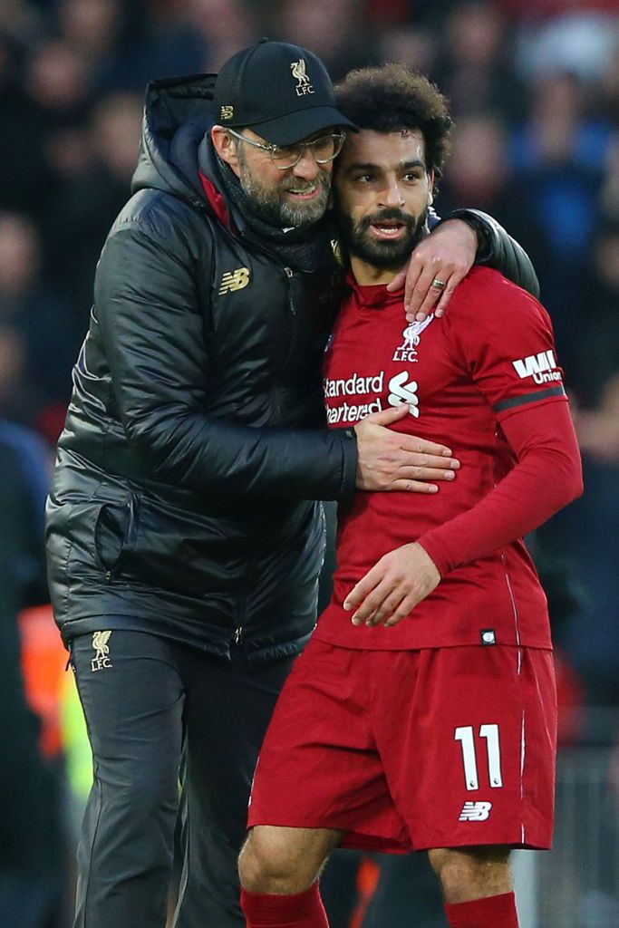 LIVERPOOL, ENGLAND - FEBRUARY 09: Jurgen Klopp, Manager of Liverpool celebrates victory with Mohamed Salah of Liverpool after the Premier League match between Liverpool FC and AFC Bournemouth at Anfield on February 9, 2019 in Liverpool, United Kingdom.  (Photo by Alex Livesey/Getty Images)