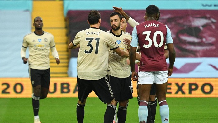 BIRMINGHAM, ENGLAND - JULY 09: Bruno Fernandes of Manchester United celebrates with Nemanja Matic after scoring his teams first goal during the Premier League match between Aston Villa and Manchester United at Villa Park on July 09, 2020 in Birmingham, England. Football Stadiums around Europe remain empty due to the Coronavirus Pandemic as Government social distancing laws prohibit fans inside venues resulting in all fixtures being played behind closed doors. (Photo by Oli Scarff/Pool via Getty Images)