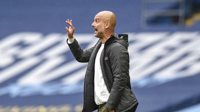 Manchester Citys head coach Pep Guardiola gestures during the English Premier League soccer match between Manchester City and Newcastle at the Ethiad Stadium in Manchester, England, Wednesday, July 8, 2020. (Oli Scarff/Pool via AP)