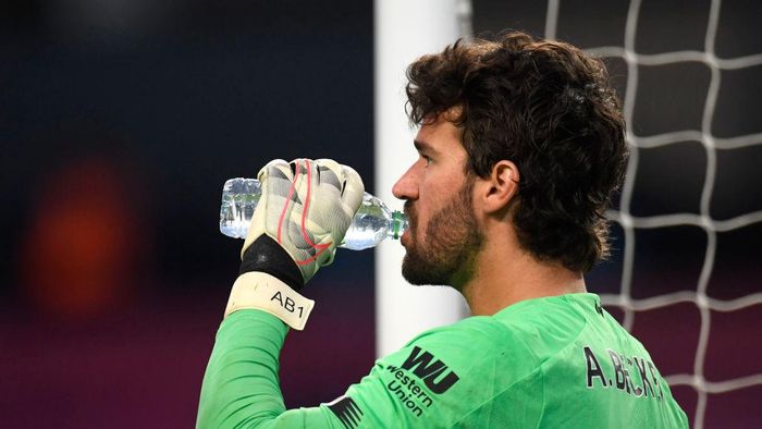 Alisson Becker MANCHESTER, ENGLAND - JULY 02: Alisson Becker of Liverpool has a drink during the Premier League match between Manchester City and Liverpool FC at Etihad Stadium on July 02, 2020 in Manchester, England. Football Stadiums around Europe remain empty due to the Coronavirus Pandemic as Government social distancing laws prohibit fans inside venues resulting in all fixtures being played behind closed doors. (Photo by Peter Powell/Pool via Getty Images)