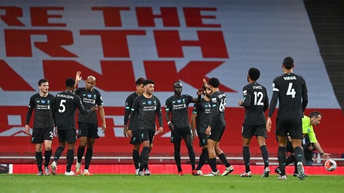 Liverpool LONDON, ENGLAND - JULY 15: Sadio Mane of Liverpool celebrates with teammates after scoring his sides first goal during the Premier League match between Arsenal FC and Liverpool FC at Emirates Stadium on July 15, 2020 in London, England. Football Stadiums around Europe remain empty due to the Coronavirus Pandemic as Government social distancing laws prohibit fans inside venues resulting in all fixtures being played behind closed doors. (Photo by Shaun Botterill/Getty Images)