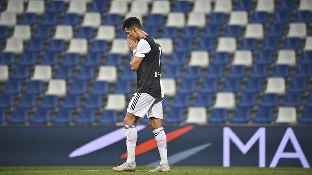 Juventus' Cristiano Ronaldo reacts during a Serie A soccer match between Sassuolo and Juventus at the Mapei Stadium in Reggio Emilia, Italy, Wednesday, July 15, 2020. (Massimo Paolone/LaPresse via AP)
