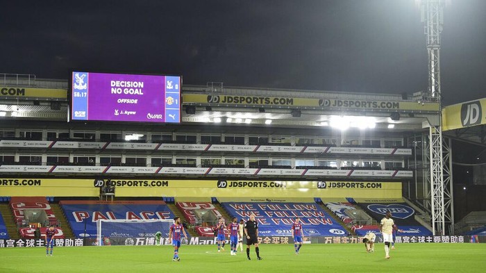 The scoreboard shows that a goal by Crystal Palaces Jordan Ayew has been disallowed by a VAR decision for offside during the English Premier League soccer match between Crystal Palace and Manchester United at Selhurst Park in London, England, Thursday, July 16, 2020. (AP Photo/Glyn Kirk, Pool)