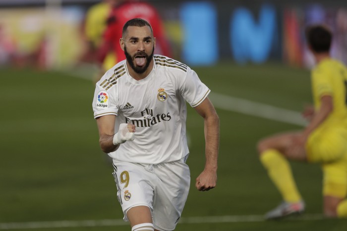 Real Madrids Karim Benzema celebrates after scoring during the Spanish La Liga soccer match between Real Madrid and Villareal at the Alfredo di Stefano stadium in Madrid, Spain, Thursday, July 16, 2020. (AP Photo/Bernat Armangue)