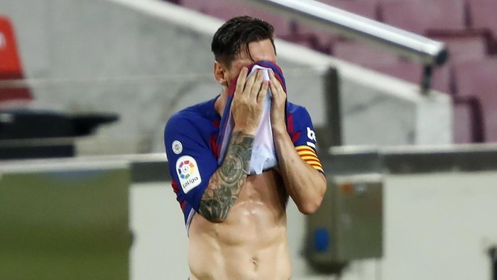 Barcelonas Lionel Messi reacts during a Spanish La Liga soccer match between Barcelona and Osasuna at the Camp Nou stadium in Barcelona, Spain, Thursday, July 16, 2020. (AP Photo/Joan Monfort)