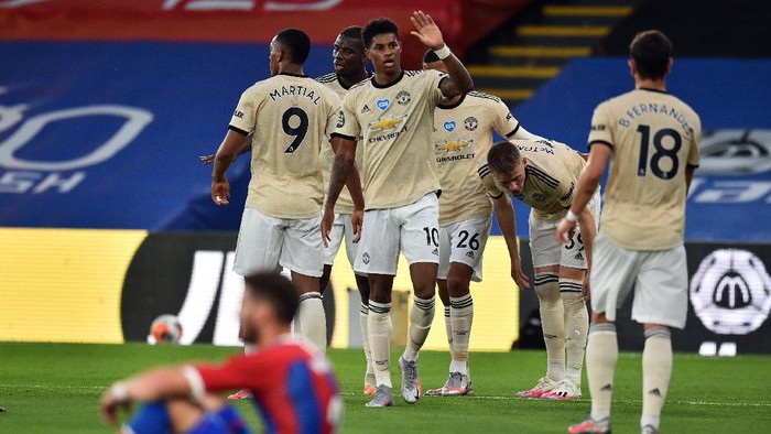 LONDON, ENGLAND - JULY 16: Marcus Rashford of Manchester United celebrates after scoring his sides first goal during the Premier League match between Crystal Palace and Manchester United at Selhurst Park on July 16, 2020 in London, England. Football Stadiums around Europe remain empty due to the Coronavirus Pandemic as Government social distancing laws prohibit fans inside venues resulting in all fixtures being played behind closed doors. (Photo by Glyn Kirk/Pool via Getty Images)
