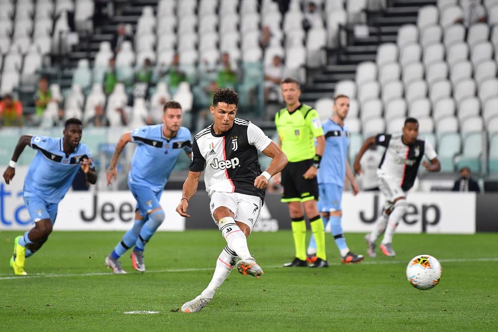 TURIN, ITALY - JULY 20:  Cristiano Ronaldo of Juventus scores the opening goal from the penalty spot during the Serie A match between Juventus and  SS Lazio at Allianz Stadium on July 20, 2020 in Turin, Italy.  (Photo by Valerio Pennicino/Getty Images)