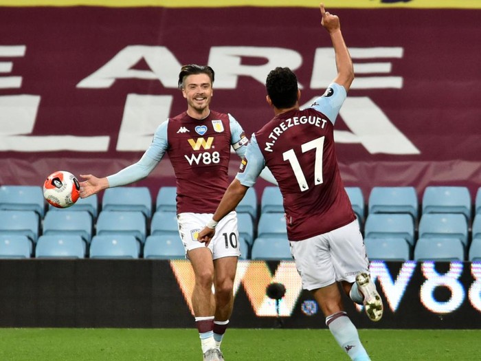 BIRMINGHAM, ENGLAND - JULY 21: Trezeguet of Aston Villa celebrates after he scores his sides 1st goal during the Premier League match between Aston Villa and Arsenal FC at Villa Park on July 21, 2020 in Birmingham, England. Football Stadiums around Europe remain empty due to the Coronavirus Pandemic as Government social distancing laws prohibit fans inside venues resulting in all fixtures being played behind closed doors. (Photo by Rui Vieira/Pool via Getty Images)