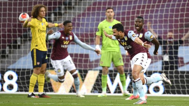 Aston Villa's Trezeguet celebrates after scoring his team's first goal during the English Premier League soccer match between Aston Villa and Arsenal at Villa Park in Birmingham, England, Tuesday, July 21, 2020. (AP Photo/Peter Powell,Pool)