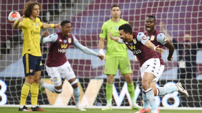 BIRMINGHAM, ENGLAND - JULY 21: Trezeguet of Aston Villa celebrates after he scores his sides 1st goal during the Premier League match between Aston Villa and Arsenal FC at Villa Park on July 21, 2020 in Birmingham, England. Football Stadiums around Europe remain empty due to the Coronavirus Pandemic as Government social distancing laws prohibit fans inside venues resulting in all fixtures being played behind closed doors. (Photo by Peter Powell/Pool via Getty Images)