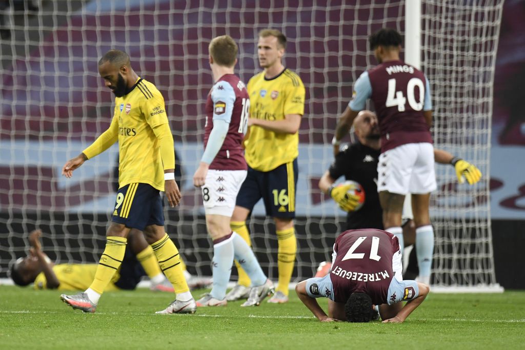 BIRMINGHAM, ENGLAND - JULY 21: Trezeguet of Aston Villa celebrates at the full time whistle during the Premier League match between Aston Villa and Arsenal FC at Villa Park on July 21, 2020 in Birmingham, England. Football Stadiums around Europe remain empty due to the Coronavirus Pandemic as Government social distancing laws prohibit fans inside venues resulting in all fixtures being played behind closed doors. (Photo by Peter Powell/Pool via Getty Images)