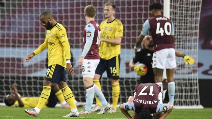 BIRMINGHAM, ENGLAND - JULY 21: Trezeguet of Aston Villa celebrates at the full time whistle during the Premier League match between Aston Villa and Arsenal FC at Villa Park on July 21, 2020 in Birmingham, England. Football Stadiums around Europe remain empty due to the Coronavirus Pandemic as Government social distancing laws prohibit fans inside venues resulting in all fixtures being played behind closed doors. (Photo by Peter Powell/Pool via Getty Images)