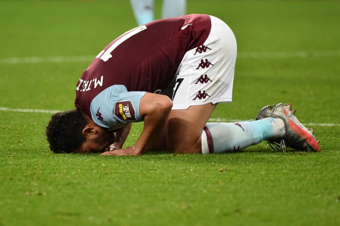 BIRMINGHAM, ENGLAND - JULY 21: Trezeguet of Aston Villa kisses the pitch after the Premier League match between Aston Villa and Arsenal FC at Villa Park on July 21, 2020 in Birmingham, England. Football Stadiums around Europe remain empty due to the Coronavirus Pandemic as Government social distancing laws prohibit fans inside venues resulting in all fixtures being played behind closed doors. (Photo by Rui Vieira/Pool via Getty Images)