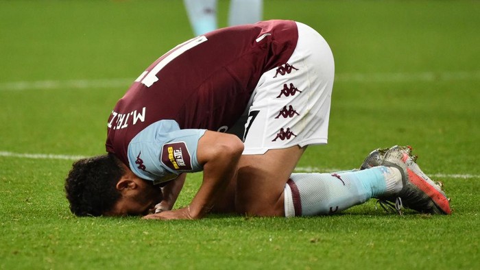 BIRMINGHAM, ENGLAND - JULY 21: Trezeguet of Aston Villa kisses the pitch after the Premier League match between Aston Villa and Arsenal FC at Villa Park on July 21, 2020 in Birmingham, England. Football Stadiums around Europe remain empty due to the Coronavirus Pandemic as Government social distancing laws prohibit fans inside venues resulting in all fixtures being played behind closed doors. (Photo by Rui Vieira/Pool via Getty Images)