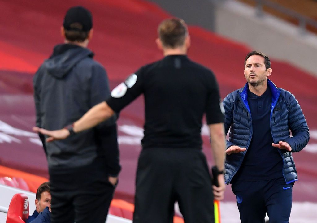 LIVERPOOL, ENGLAND - JULY 22: Frank Lampard, Manager of Chelsea and Jurgen Klopp, Manager of Liverpool speak during the Premier League match between Liverpool FC and Chelsea FC at Anfield on July 22, 2020 in Liverpool, England. Football Stadiums around Europe remain empty due to the Coronavirus Pandemic as Government social distancing laws prohibit fans inside venues resulting in all fixtures being played behind closed doors. (Photo by Laurence Griffiths/Getty Images)