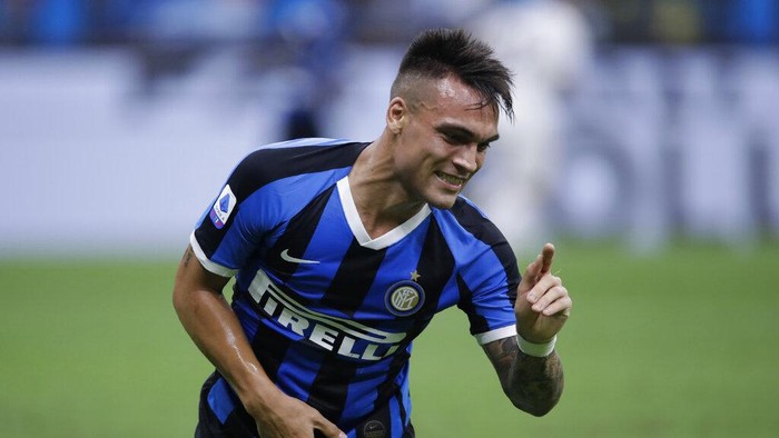 Inter Milans Lautaro Martinez gestures during a Serie A soccer match between Inter Milan and Fiorentina, at the San Siro stadium in Milan, Italy, Wednesday, July 22, 2020. (AP Photo/Luca Bruno)