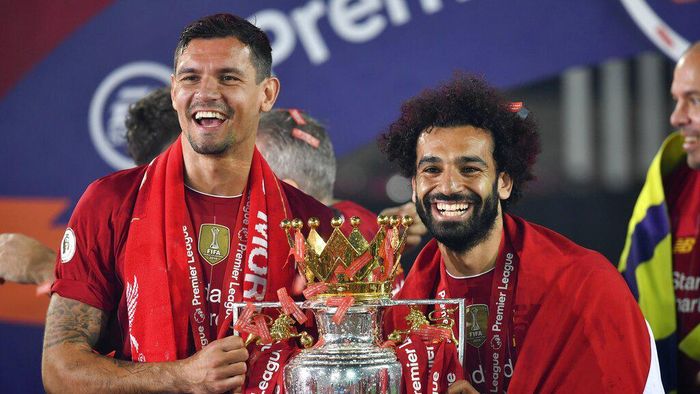 Dejan Lovren Liverpools Dejan Lovren and Liverpools Mohamed Salah celebrate with the English Premier League trophy aloft after it was presented following the Premier League soccer match between Liverpool and Chelsea at Anfield stadium in Liverpool, England, Wednesday, July 22, 2020. (Paul Ellis, Pool via AP)