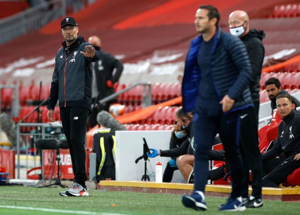 LIVERPOOL, ENGLAND - JULY 22: Frank Lampard, Manager of Chelsea and Jurgen Klopp, Manager of Liverpool speak during the Premier League match between Liverpool FC and Chelsea FC at Anfield on July 22, 2020 in Liverpool, England. Football Stadiums around Europe remain empty due to the Coronavirus Pandemic as Government social distancing laws prohibit fans inside venues resulting in all fixtures being played behind closed doors. (Photo by Laurence Griffiths/Getty Images)
