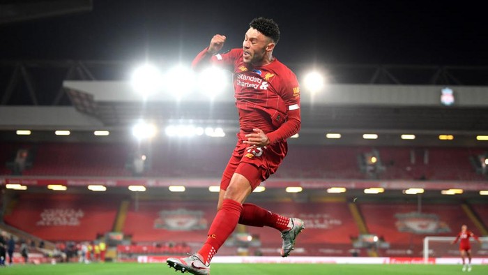 LIVERPOOL, ENGLAND - JULY 22: Alex Oxlade-Chamberlain of Liverpool celebrates after scoring his teams fifth goal during the Premier League match between Liverpool FC and Chelsea FC at Anfield on July 22, 2020 in Liverpool, England. Football Stadiums around Europe remain empty due to the Coronavirus Pandemic as Government social distancing laws prohibit fans inside venues resulting in all fixtures being played behind closed doors. (Photo by Laurence Griffiths/Getty Images)