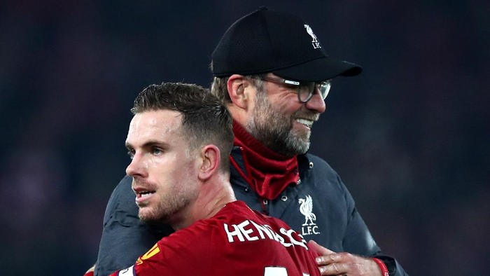 LIVERPOOL, ENGLAND - DECEMBER 29: Jurgen Klopp, Manager of Liverpool and Jordan Henderson of Liverpool during the Premier League match between Liverpool FC and Wolverhampton Wanderers at Anfield on December 29, 2019 in Liverpool, United Kingdom. (Photo by Clive Brunskill/Getty Images)