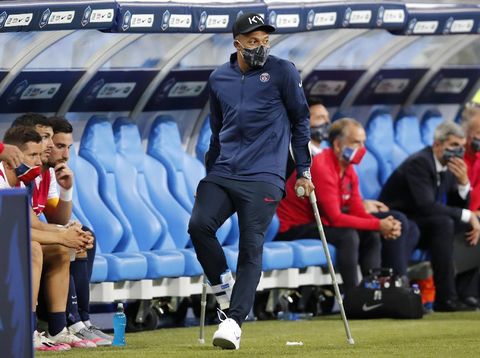 PSG's Kylian Mbappe walks using crutches after being injured during the French Cup soccer final match between Paris Saint Germain and Saint Etienne at Stade de France stadium, in Saint Denis, north of Paris, Friday July 24, 2020. (AP Photo/Francois Mori)