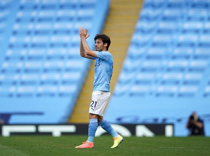 MANCHESTER, ENGLAND - JULY 26: David Silva of Manchester City applauds as he is substituted during the Premier League match between Manchester City and Norwich City at Etihad Stadium on July 26, 2020 in Manchester, England.Football Stadiums around Europe remain empty due to the Coronavirus Pandemic as Government social distancing laws prohibit fans inside venues resulting in all fixtures being played behind closed doors. (Photo by Dave Thompson/Pool via Getty Images)