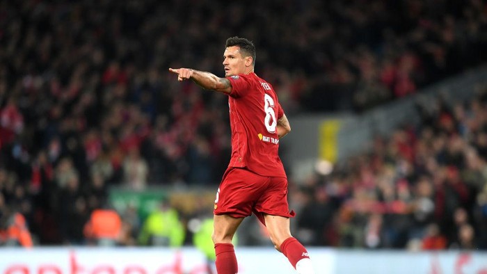 LIVERPOOL, ENGLAND - NOVEMBER 27: Dejan Lovren of Liverpool celebrates after scoring his teams first goal during the UEFA Champions League group E match between Liverpool FC and SSC Napoli at Anfield on November 27, 2019 in Liverpool, United Kingdom. (Photo by Michael Regan/Getty Images)