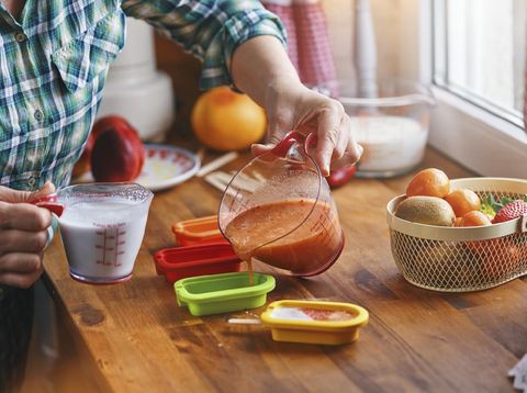 Preparing Fruit Ice Cream on Stick in Domestic Kitchen