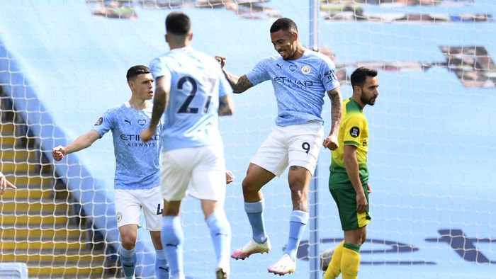 Manchester City vs Norwich City MANCHESTER, ENGLAND - JULY 26: Gabriel Jesus of Manchester City celebrates after scoring the opening goal during the Premier League match between Manchester City and Norwich City at Etihad Stadium on July 26, 2020 in Manchester, England.Football Stadiums around Europe remain empty due to the Coronavirus Pandemic as Government social distancing laws prohibit fans inside venues resulting in all fixtures being played behind closed doors. (Photo by Peter Powell/Pool via Getty Images)