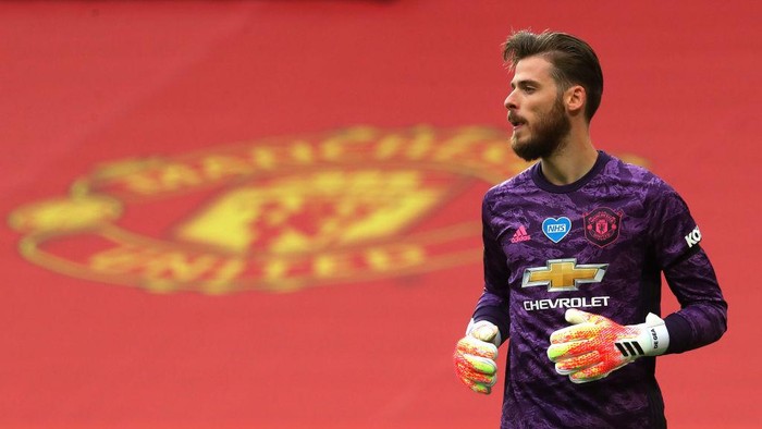MANCHESTER, ENGLAND - JULY 22: David De Gea of Manchester United looks on during the Premier League match between Manchester United and West Ham United at Old Trafford on July 22, 2020 in Manchester, England. Football Stadiums around Europe remain empty due to the Coronavirus Pandemic as Government social distancing laws prohibit fans inside venues resulting in all fixtures being played behind closed doors. (Photo by Catherine Ivill/Getty Images)