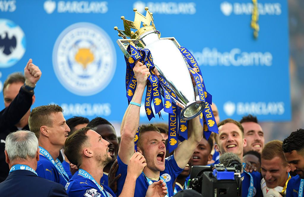LEICESTER, ENGLAND - MAY 07:  Jamie Vardy of Leicester City lifts the Premier League Trophy as players and staffs celebrate the season champions after the Barclays Premier League match between Leicester City and Everton at The King Power Stadium on May 7, 2016 in Leicester, United Kingdom.  (Photo by Shaun Botterill/Getty Images)