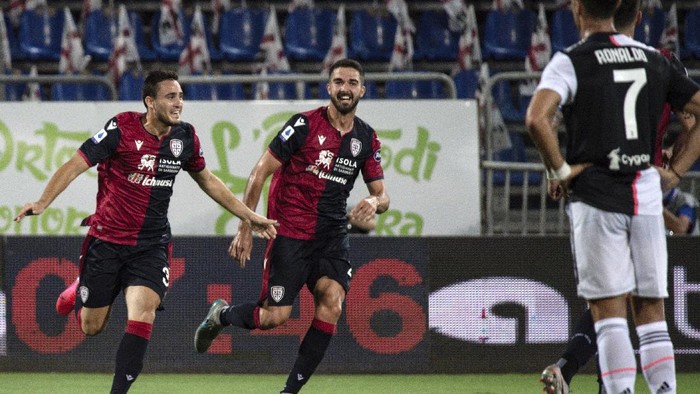 Cagliaris Luca Gagliano, left, celebrates after scoring during the Serie A soccer match between Cagliari and Juventus, at the Sardegna Arena stadium, in Cagliari, Italy, Wednesday, July 29, 2020. (Alessandro Tocco/Lapresse via AP)